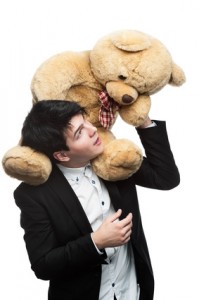businessman with big soft toy on shoulders
